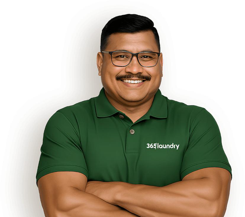 365 Laundry Professional holding a clean shirt